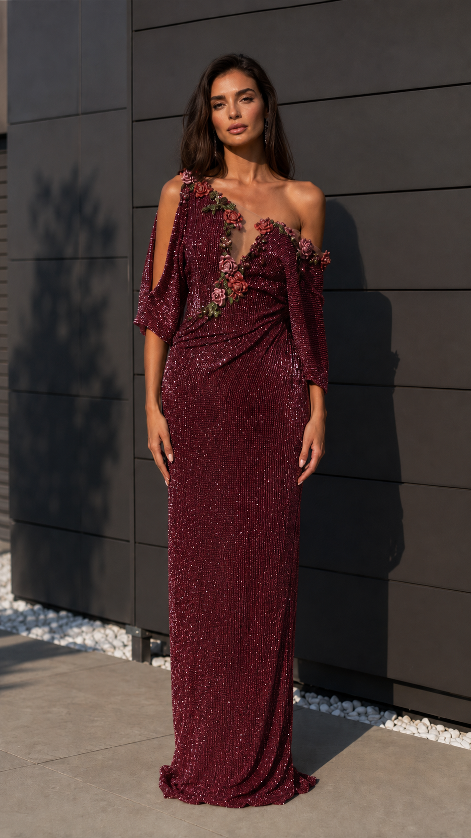 Burgundy one-shoulder sequin evening gown with floral appliqué and floor-length silhouette