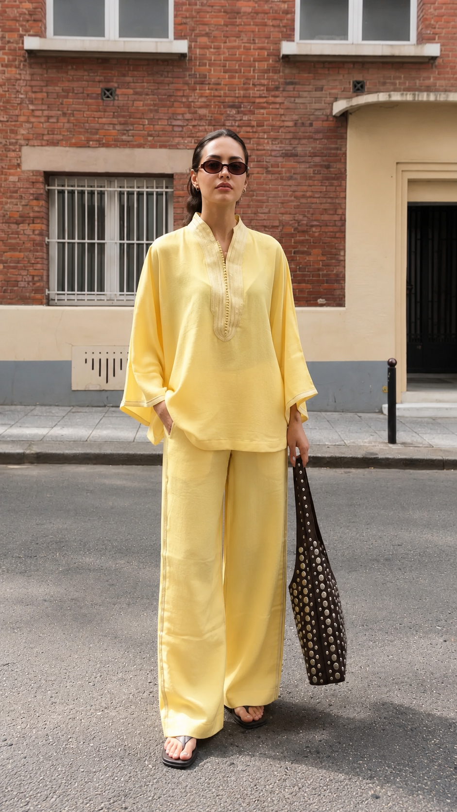 Front view of butter yellow relaxed embroidered neckline top and wide-leg pants set