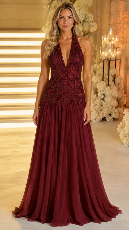 Front view of burgundy halter plunge evening gown with embellished bodice and long skirt